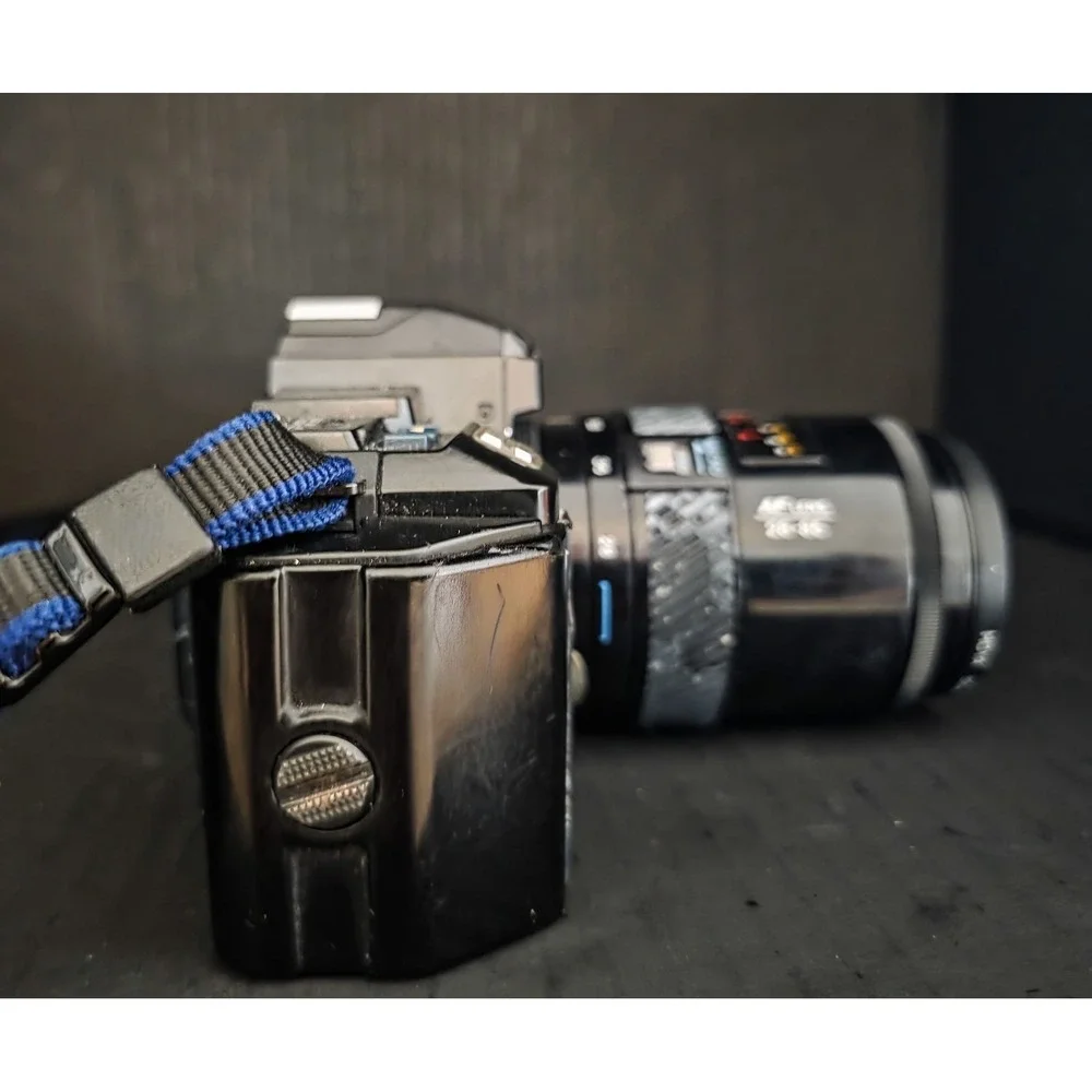 Minolta Maxxum 7000 35mm SLR Film Camera with 28-300, 70-210, and 28-85 Lenses